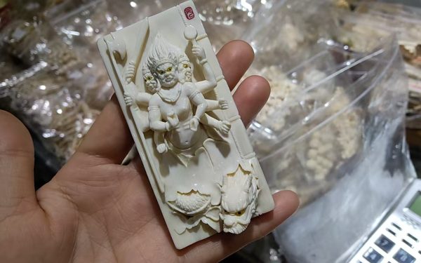 Two Mammoth Ivory Hand-Carved Pendants